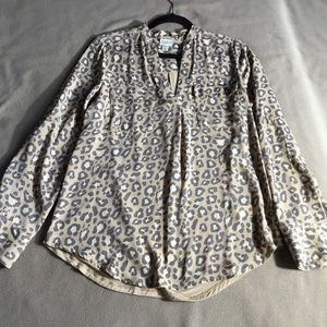 Woman’s open neck animal print blouse